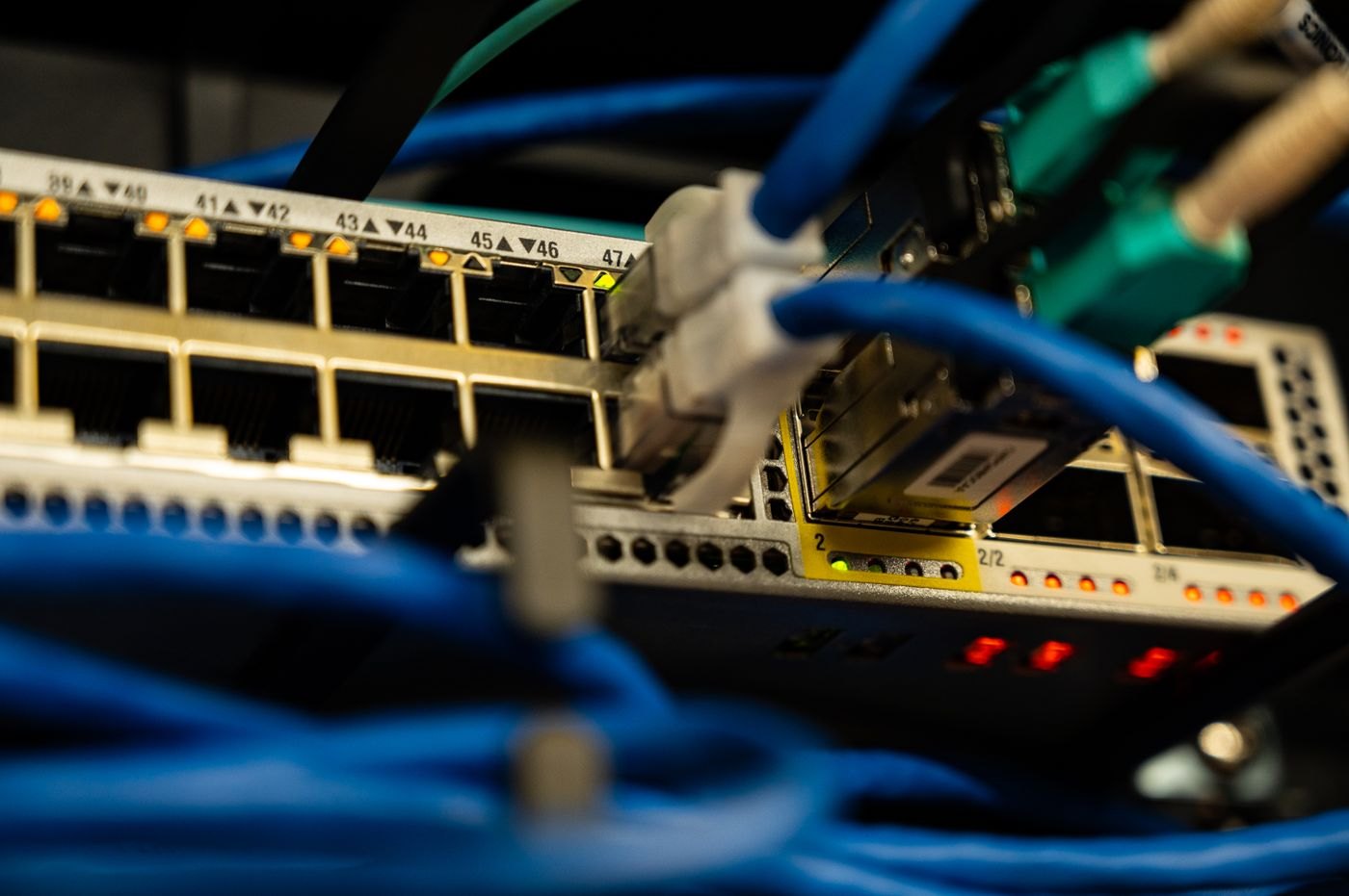 Ethernet connections link network equipment and connected devices.