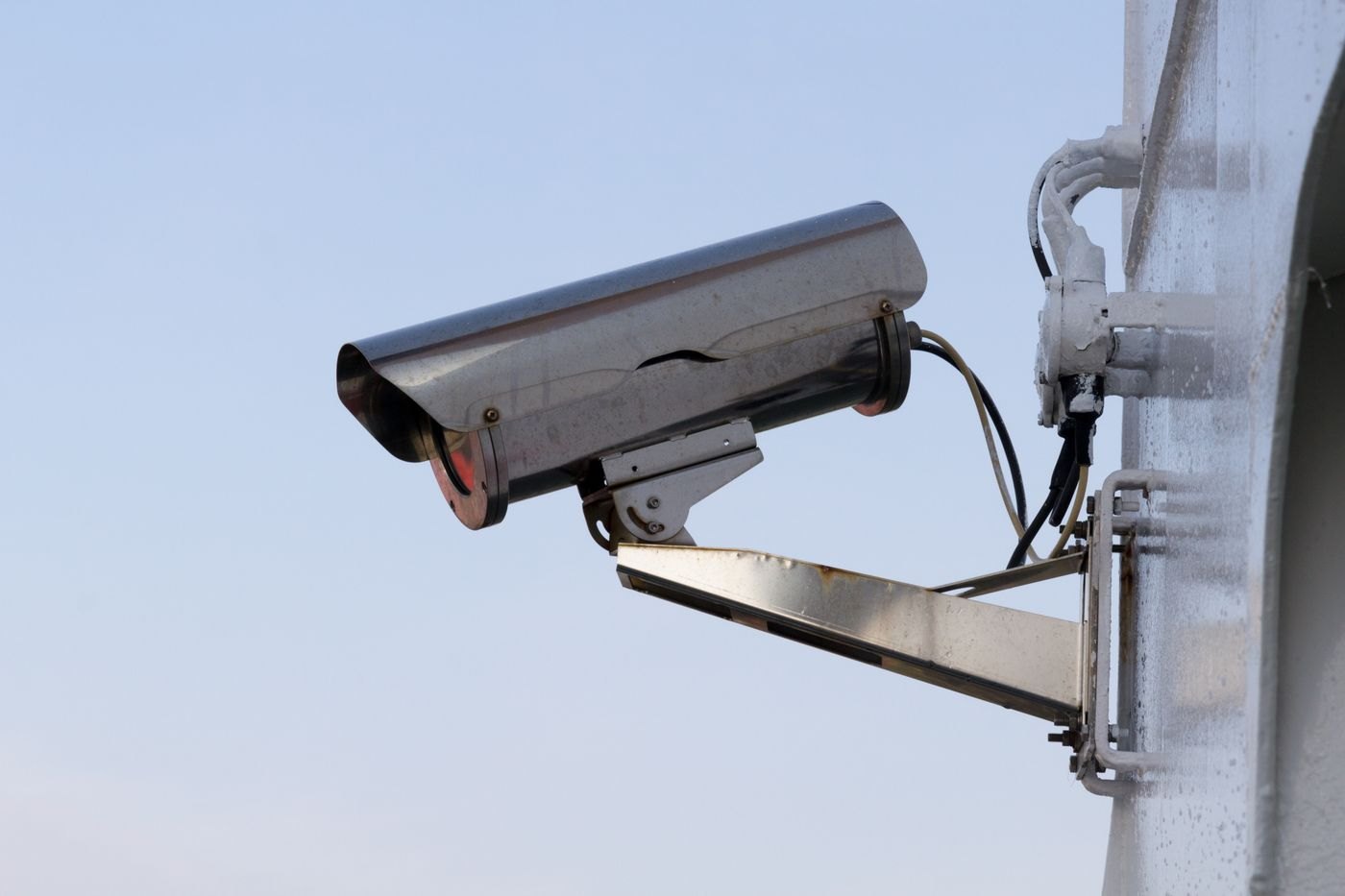 A fixed surveillance camera illustrates electronic security equipment.