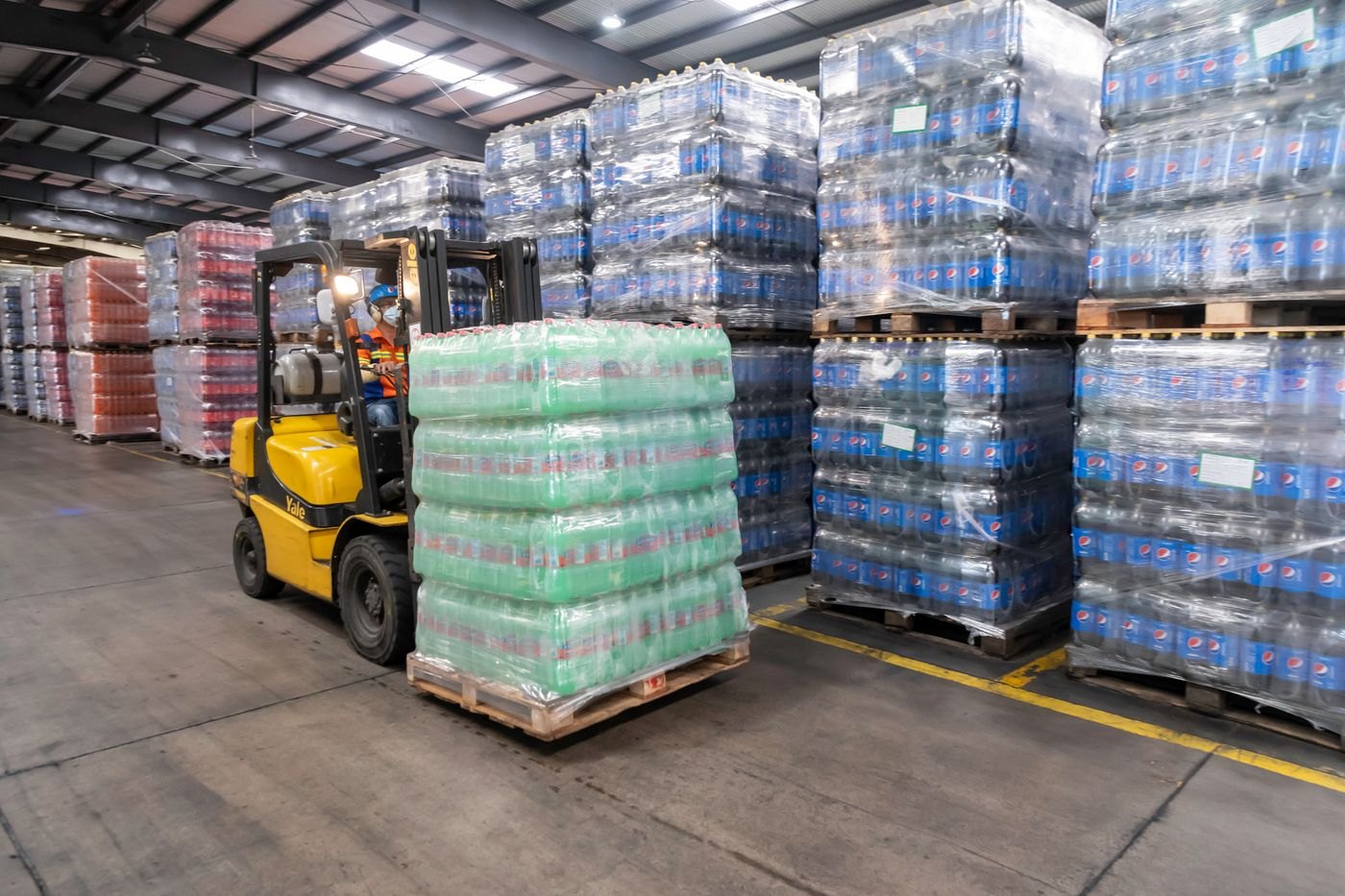 Pallet handling and warehouse storage support the movement of operational supplies.
